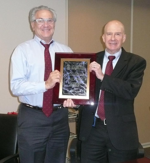 The Lawyer Referal Information Services (LRIS Chair), Joseph H. Rosen presenting the plaque to Immediate Past Chair, Robert E. Turner